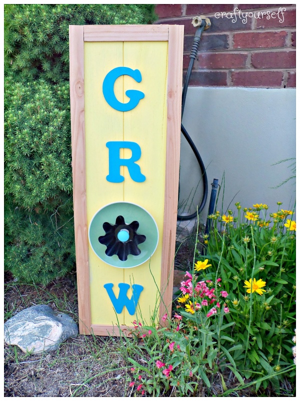 Summertime Grow flower sign using dishes displayed