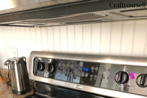 Close up beadboard behind stove